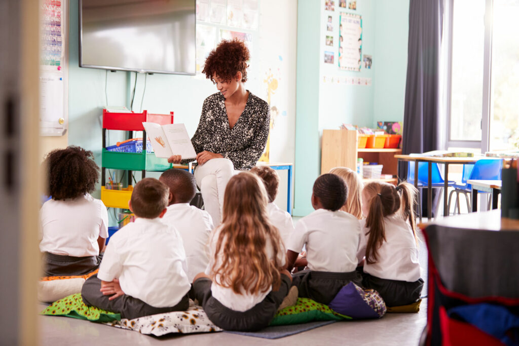 Primary Teacher Reading to Class